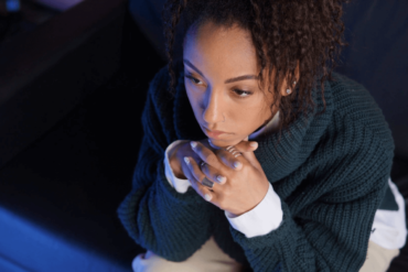 Woman anxious and sitting.